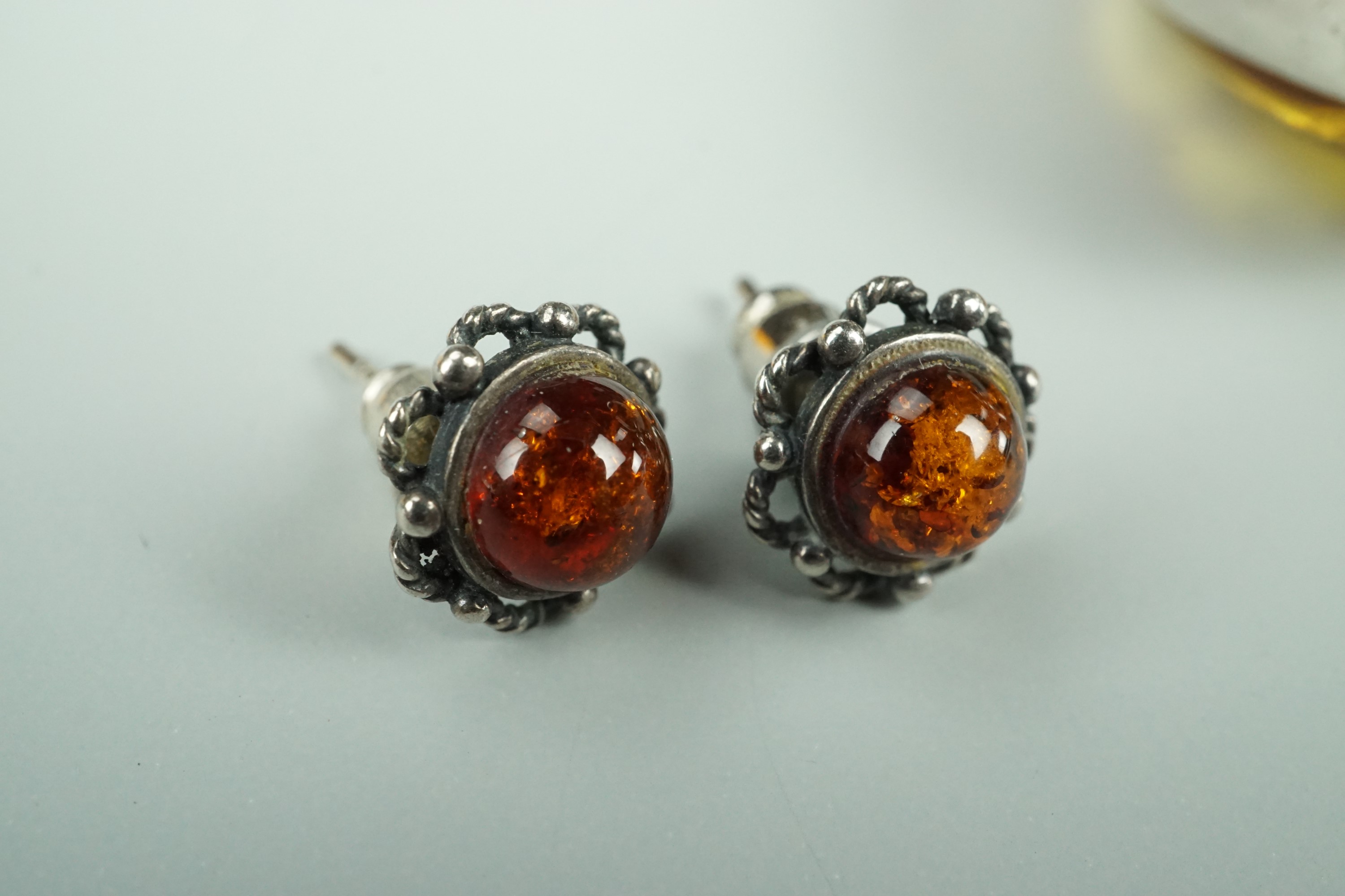 A large asymmetric amber cabochon ring, bezel-set in white metal, stamped 925 and tested as - Image 3 of 7