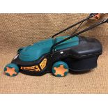 A Black & Decker electric lawn mower and grass box