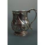 An early Victorian silver Christening cup, of baluster form, decorated in repeating repousse-