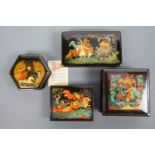 Four Soviet and Russian lacquer boxes, each painted in depiction of a mythological or heroic