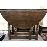 An early 18th Century joined-oak gate leg table of diminutive stature, 90 cm x 91 cm x 67 cm high