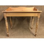 A contemporary pine desk / wash stand