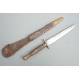 A Second World War British military third pattern FS / Fairbairn Sykes fighting knife, the grip