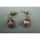 A pair of amethyst and yellow metal ear pendants, 2 cm