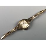 A 1950s lady's Majex 9 ct gold wristlet watch and 9 ct gold flexible bracelet strap, 8.9 g excluding