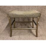 A Lusty's Lloyd Loom dressing table stool with saddle-form seat