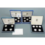 Four cased sets of Royal Mint silver proof one pound coins, nineteen coins