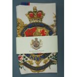 A Buckingham Palace commemorative tea towel in original packaging