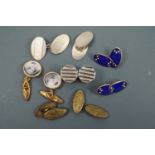 A set of 1953 coronation commemorative cuff links, an engine-turned silver pair, a pair of