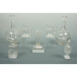 Two Victorian cut glass carafes / decanters, two scent bottles, a pair of small jugs and a vase