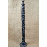 A large African sectional carved hardwood lamp base, 117 cm