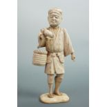 A Meiji Japanese bone okimono of a man carrying a basket and large fruit, 16 cm