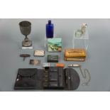 Sundry collectors' items including a glass poison bottle, tinplate boxes, dip pen nibs, a whistle,