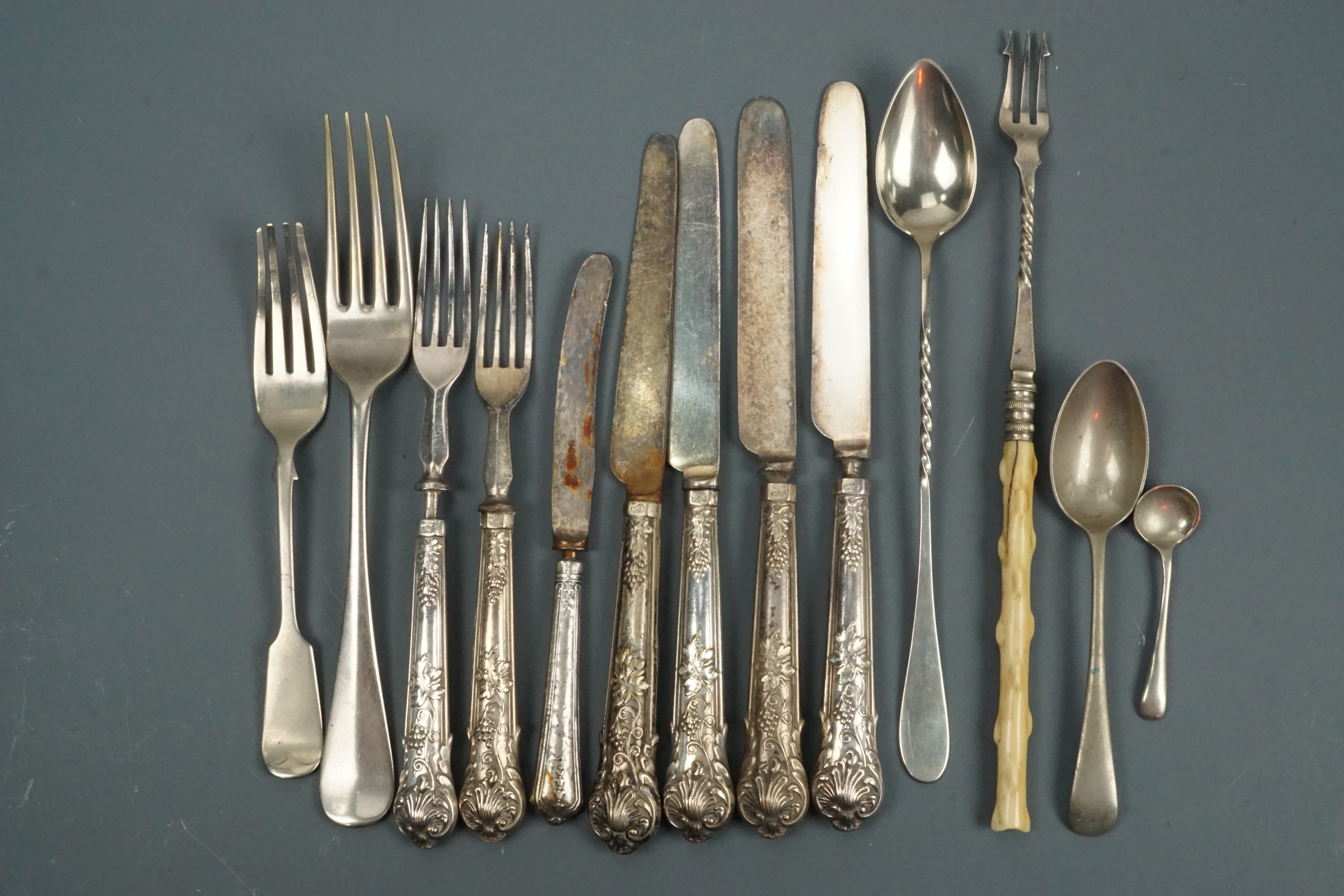 An electroplate pickle fork, a cocktail spoon and other cutlery