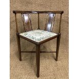 A Sheraton Revival string-inlaid mahogany corner armchair