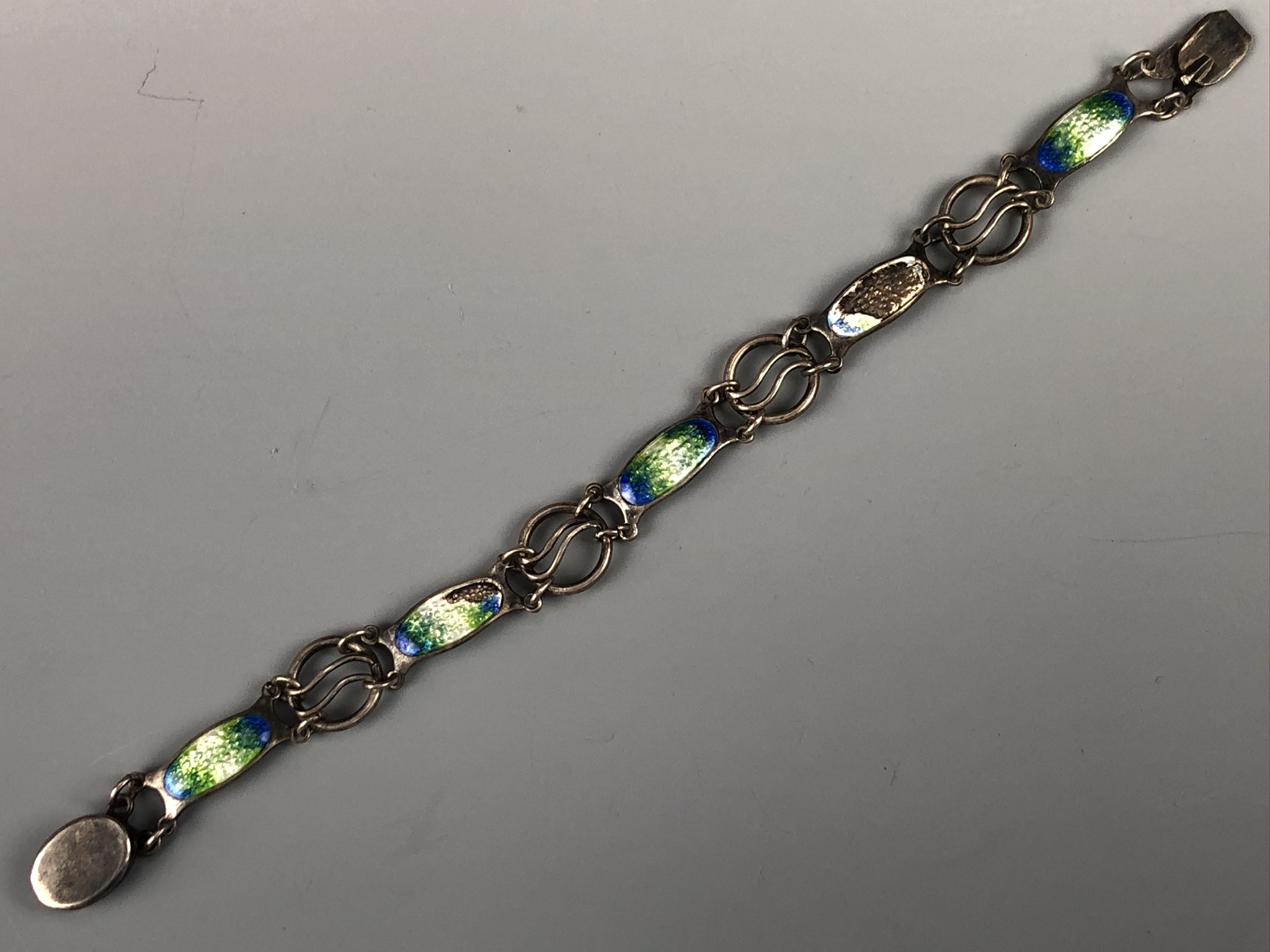 An antique Arts and Crafts influenced basse-taille enamelled silver bracelet, having organic plaques - Image 3 of 3