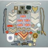 Sundry items of military cloth insignia and lanyards