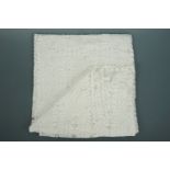 A cotton whitework throw