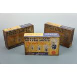 Three tinplate counter-top display tins for Endura Auto Motor Lamps, each containing original