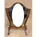 An old reproduction George III Sheraton style shield-shaped swivel toilet mirror