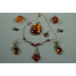 A pair of amber ear pendants, a pendant necklace etc