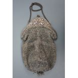 A Belle Epoque lady's cut steel evening bag, with electroplate cantle relief-decorated with Bacchian