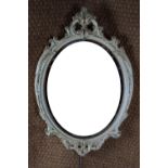 A Crown Works reproduction oval mirror, 71 cm high