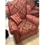 A quality three-piece suite upholstered in a red floral fabric