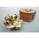 A miniature reproduction brass sextant, approx 10 cm x 10 cm