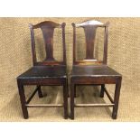 A pair of George III country oak dining chairs