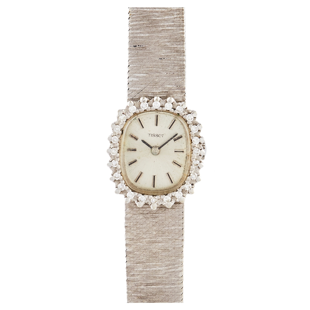 Reloj Tissot señora en oro blanco con diamantes. Mecanismo de cuerda manual.