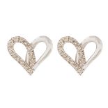 Pendientes diseño corazón en oro blanco con diamantes.