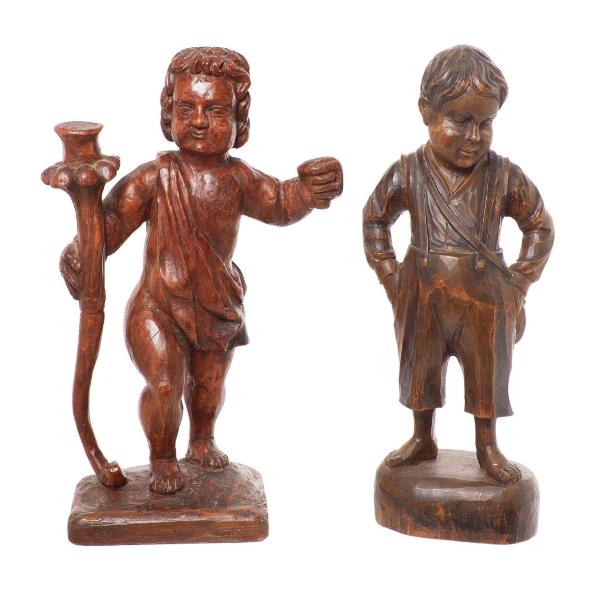 Escuela española, fles. del s.XIX. Niño y Niño torchero. Pareja de esculturas en madera tallada.