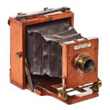 Cámara fotográfica de placas inglesa Lancaster & Son. en madera de caoba, ppios. del s.XX.