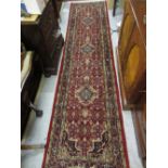 Good quality modern Indo Persian runner with a triple medallion and all-over Herati design on a wine