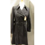 Aquascutum ladies navy blue trench coat, size 12, together with a black Orla Kiely coat with belt,