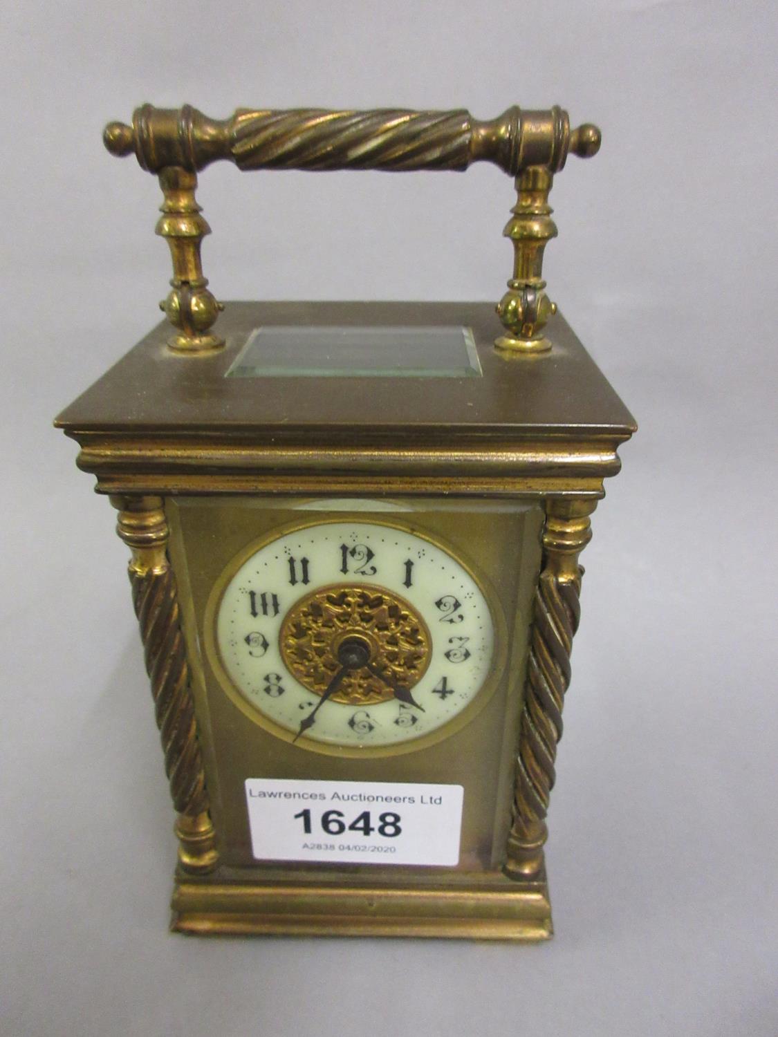 Small gilt brass cased carriage clock, the circular enamel dial with Arabic numerals, the case