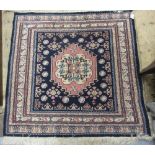 Small Pakistan rug with a single medallion design on a blue ground, 3ft square approximately,