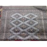 Pakistan rug of Turkoman design with a single row of gols on a grey ground, together with another