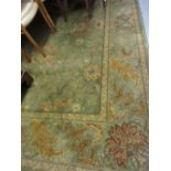 Egyptian Royal Agra pattern carpet on green ground, approximately 9ft x 11ft Generally in good