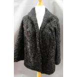 Ladies Persian lamb fur jacket and a velvet covered equestrian helmet