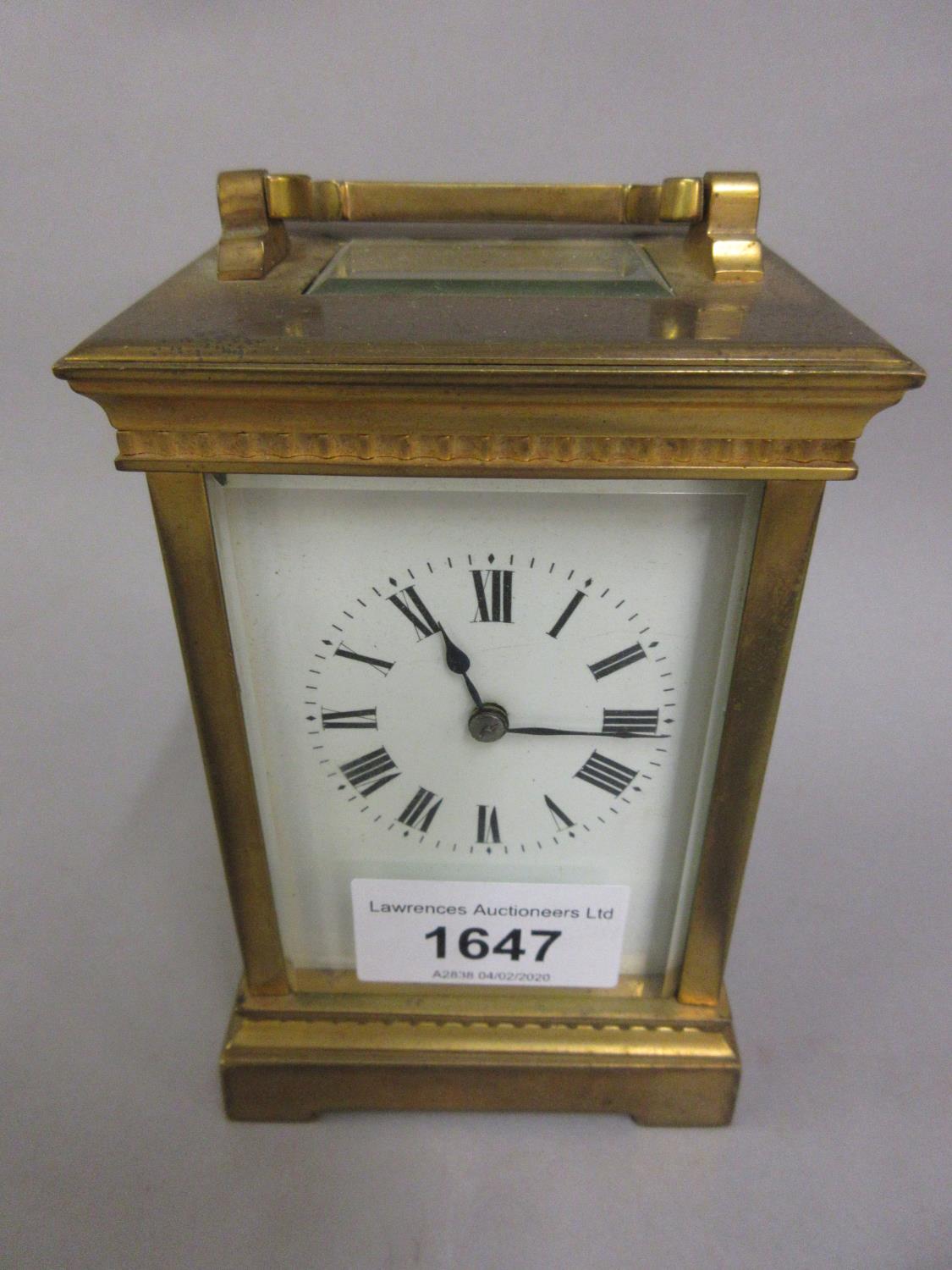 Small gilt brass carriage clock, the side panels decorated in enamel with Chinese figures, the