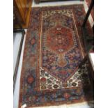 Hamadan rug with a lobed medallion and all-over stylised floral design predominantly in shades of