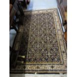 Indo Persian rug with an allover stylised Herati design on a midnight blue ground with borders,