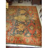 Agra carpet of all-over floral design on burgundy ground with multiple borders, 119ins x 167ins