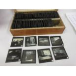 Wooden cased part set of black and white magic lantern slides, various scenes