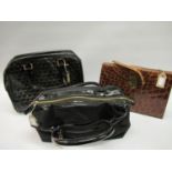 Two Jaeger ladies black patent leather handbags, together with a leather simulated crocodile handbag