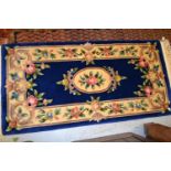 Small Chinese blue ground rug, similar rug with cream ground and a small machine woven red ground