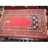 Small Persian style prayer rug having pale pink ground with central vase design and borders, 3ft x