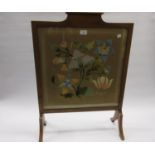 Floral silk and gold thread needlework panel housed in a firescreen together with six woolwork